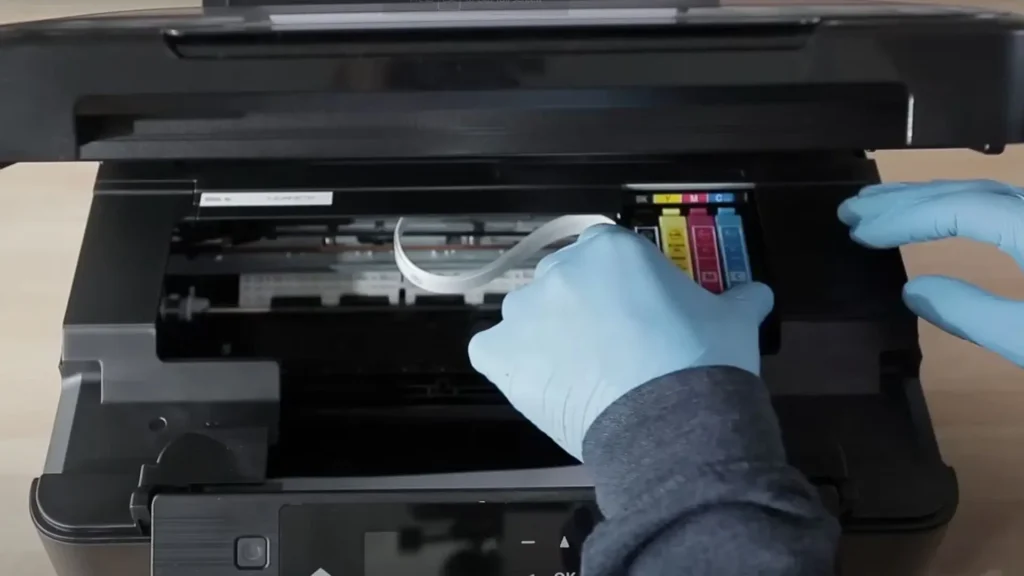 A sublimation printer cleaning starting up. 