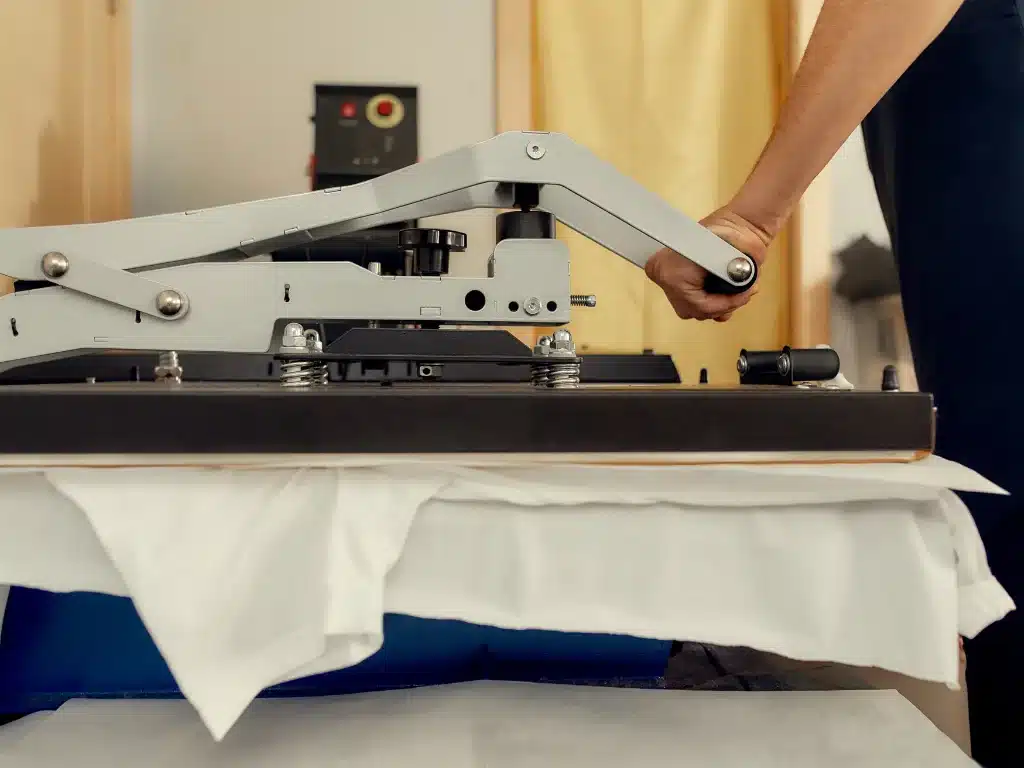 A man working with heat press temperature for sublimation