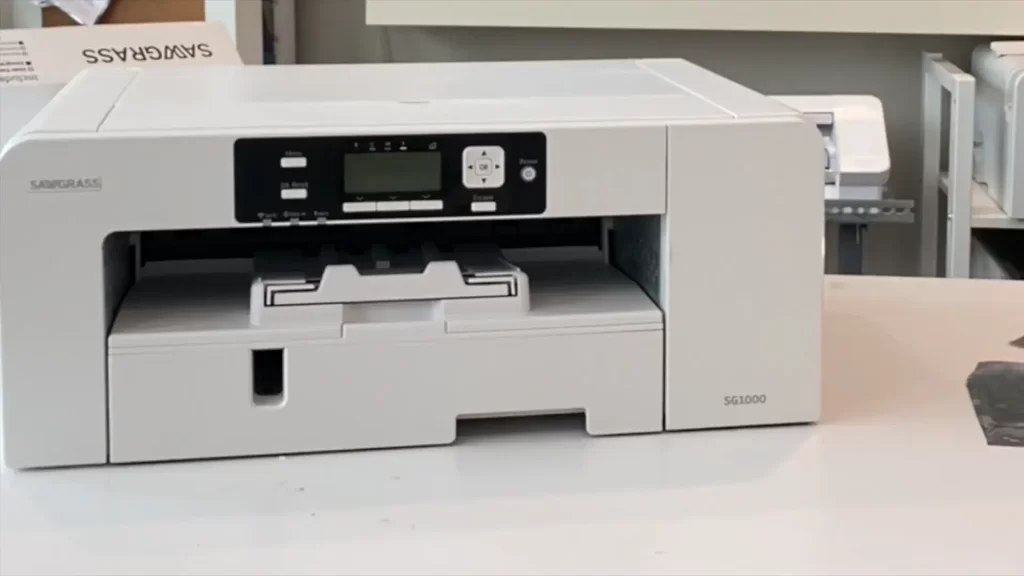 A Sawgrass SG1000 Sublimation Printer placed on a white table.