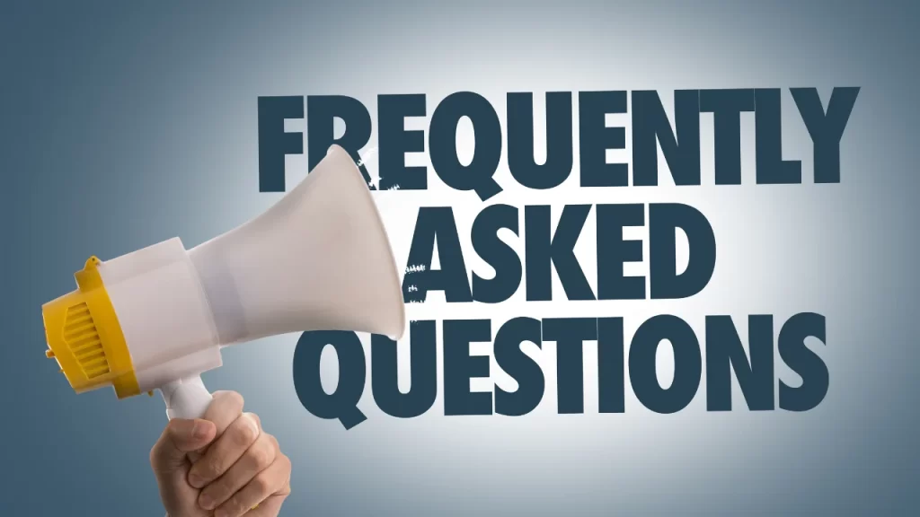 A hand holding a megaphone against a blue background with the text “FREQUENTLY ASKED QUESTIONS” emerging from it.