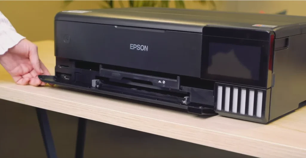 A black Epson ET-8550 printer place on a table.