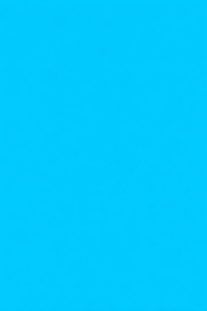 Solid cyan printer purge sheet filling the entire page edge to edge with smooth even ink coverage, clean printable CMYK test page style, no text or borders.